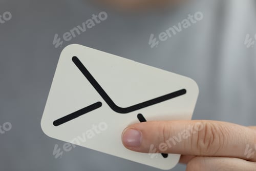 Preview: Concept of mailing and communication, hand holding a digital paper envelope