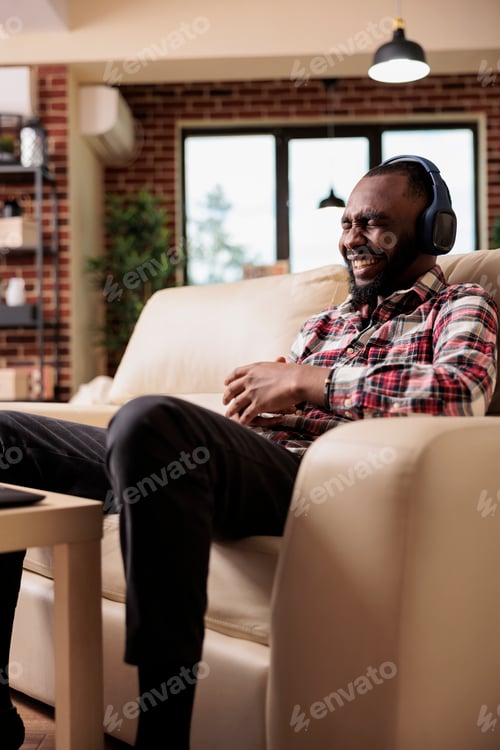 Preview: Male freelancer working and listening to music
