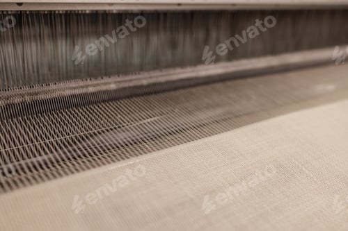 Preview: Yarn thread lines on the weaving loom machine. Weaving loom in textile factory.