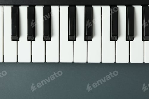 Preview: Piano keyboard on dark background, space for text