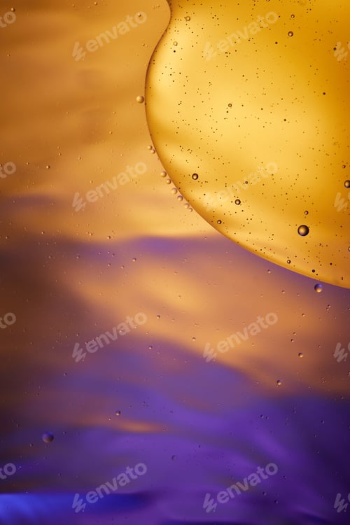 Preview: Beautiful abstract background from mixed water and oil in orange and purple color