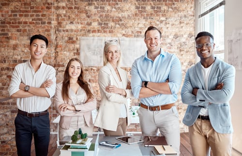 Preview: Group of diverse architects discussing plans, blueprints and schematics during a meeting in their o