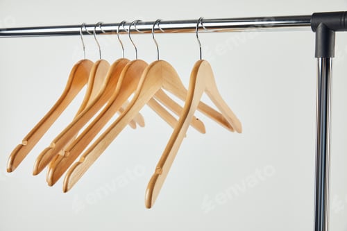 Preview: Wooden Clothes Hangers on a Chrome Rack