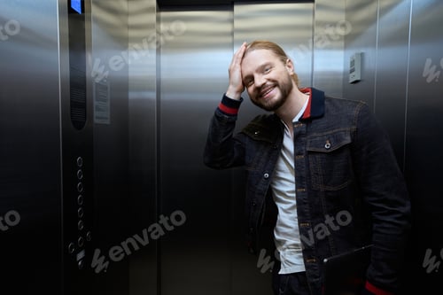 Preview: Guy in a denim jacket is in the passenger elevator