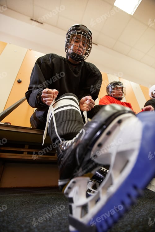 Preview: Female Hockey Player Putting on Skates