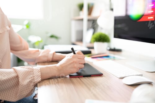 Preview: Closeup of a graphic designer using tablet