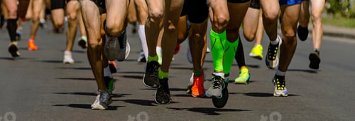 Preview: close-up legs runners athletes running city marathon