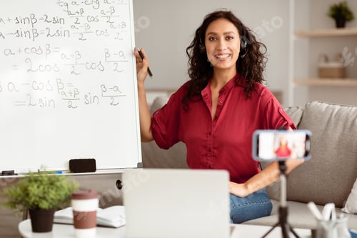 Preview: Lady teacher in headphones explaining trigonometric functions to students online
