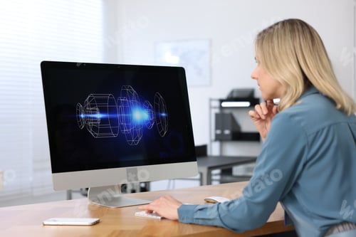 Preview: Engineer working with computer at table in office