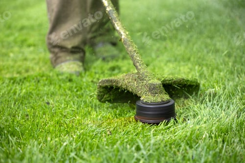 Preview: Lawn mover on green grass. Machine for cutting lawns.