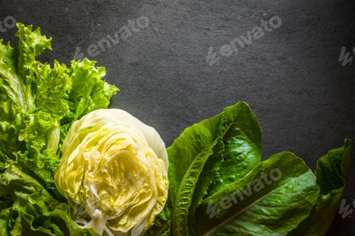 Preview: Green salad, iceberg lettuce and spinach left on the table