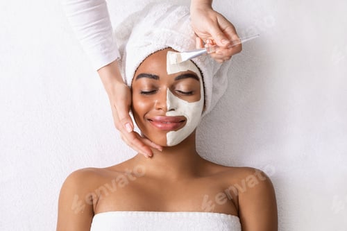 Preview: Black woman with white mask on half of her face