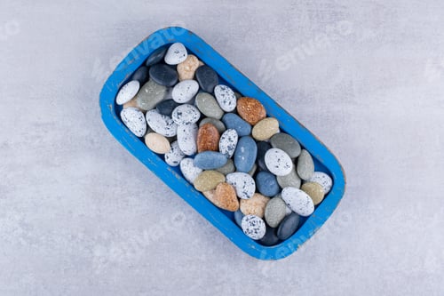 Preview: Multicolor decorative stones isolated on concrete background
