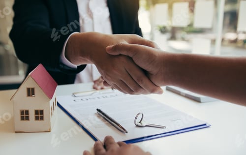 Preview: Home sales agents and buyers work on signing new homes and shaking hands.