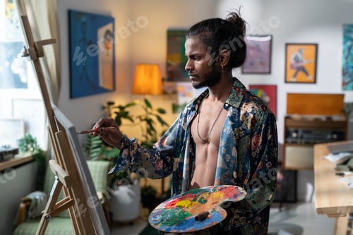 Preview: Young contemporary painter with color palette creating new artwork