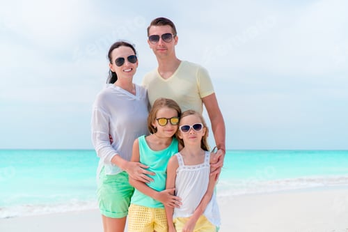 Preview: Parents and kids on beach vacation. Closeup of family