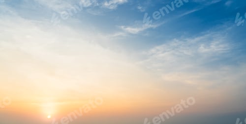 Preview: Golden Sky at Sunrise with Wispy Clouds