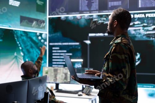 Preview: Military staff in high tech command post work on data integration