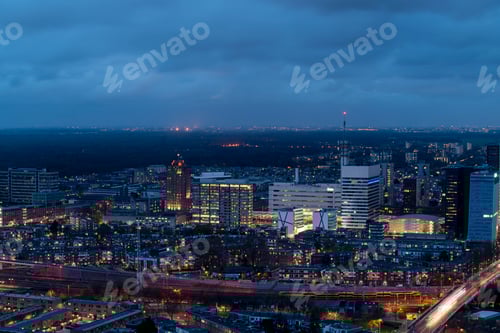 Preview: City lights twinkling as dusk turns to night