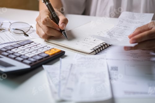 Preview: young woman checking bills, taxes, bank account balance and calculating expenses