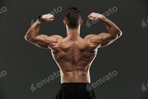 Preview: Back view of a muscular bodybuilder flexing biceps