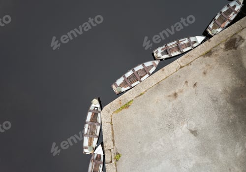 Preview: Drone aerial scenery of a river with boat moored on the river side. Keimeens Ireland County