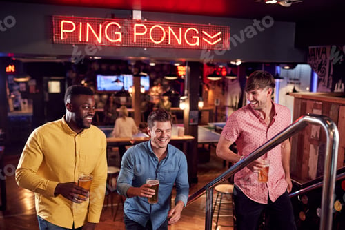 Preview: Three Male Friends Climbing Stairs As They Meet For Drinks And Socialize In Bar