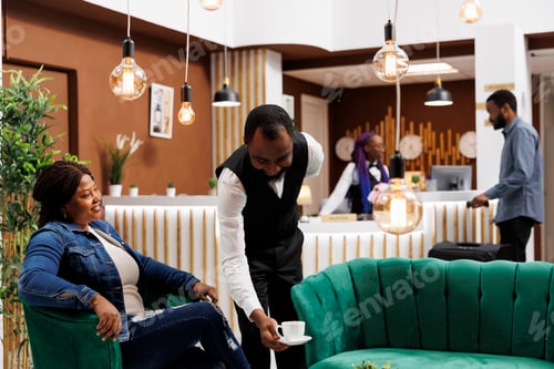 Preview: Woman tourist relaxing in hotel lobby
