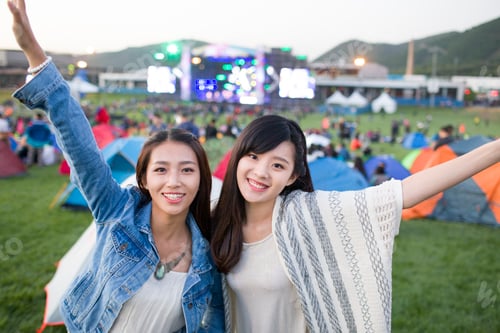 Preview: Two Women Enjoying Outdoor Music Festival