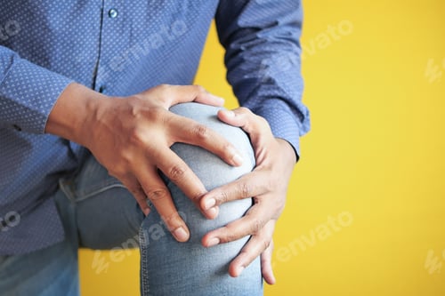 Preview: Close up on man suffering knee joint pain