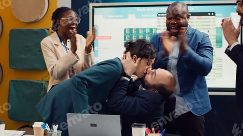 Preview: Pleased happy manager celebrating victory and kissing his employee