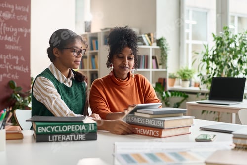 Preview: Two Black Girls Using Tablet in Class and Working on Online Presentation