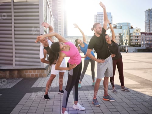 Preview: Young multiracial team warming up before workout
