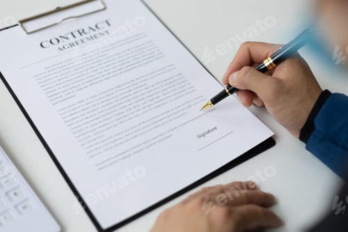 Preview: Close-up business man holding pen writing signing contract document agreement.