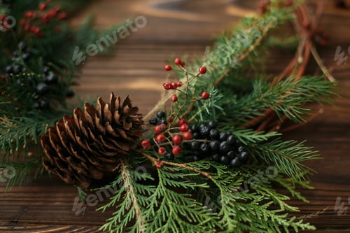 Preview: Rustic christmas wreath on wooden table, holiday advent, close up.