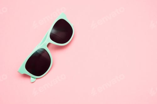 Preview: Green pastel sunglasses. Summer concept.