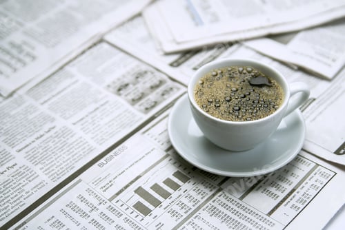 Preview: Coffee over newspaper