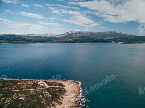 Preview: Rocky coastline on the Lustica peninsula overlooking Mount Lovcen in Montenegro. Aerial top view.