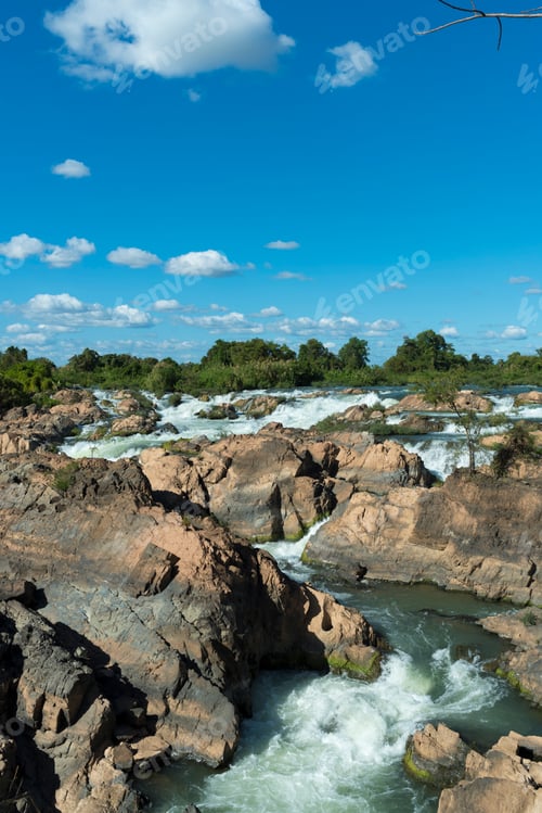 Preview: Tropical waterfall with blue sky in Laos