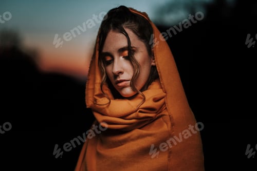 Preview: Closeup shot of a Spanish girl with her eyes closed at sunset