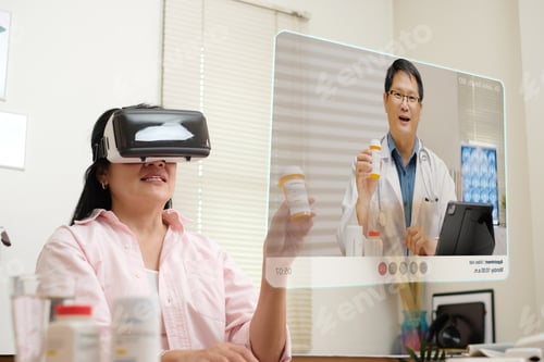 Preview: asian woman telemedicine doctor online visit with virtual reality technology vr glasses at home
