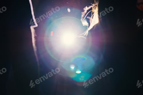 Preview: Blurred abstract light with bokeh from spotlight with silhouette. Cinematic lighting natural effect