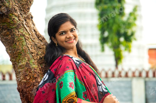 Preview: Happy young beautiful Indian woman at the park outdoor