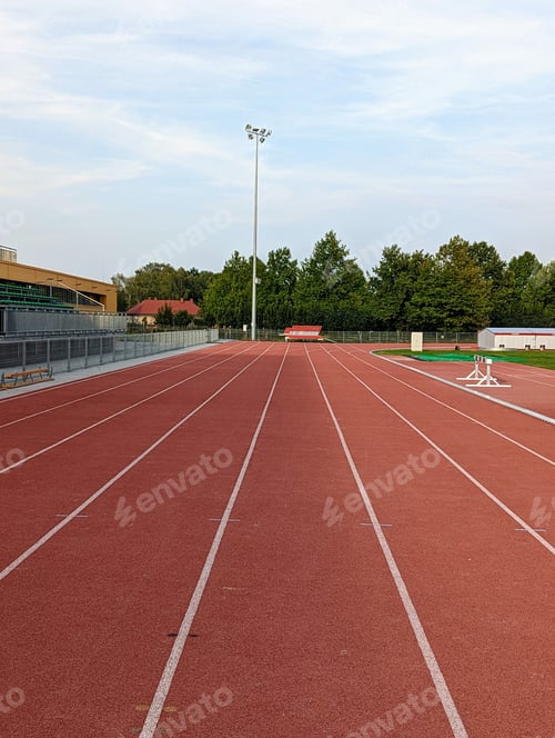 Preview: Vertical top view red empty track lane around the field