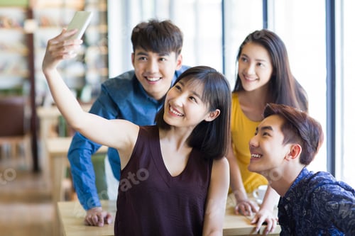 Preview: Young friends taking self portrait with a smart phone