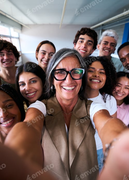 Preview: Portrait cheerful multiracial group of students friends taking selfie with female teacher in class.