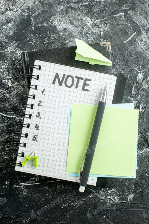 Preview: top view open notepad with pen and note writing on gray background copybook school color student