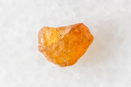 Preview: unpolished hessonite grossular crystal on white