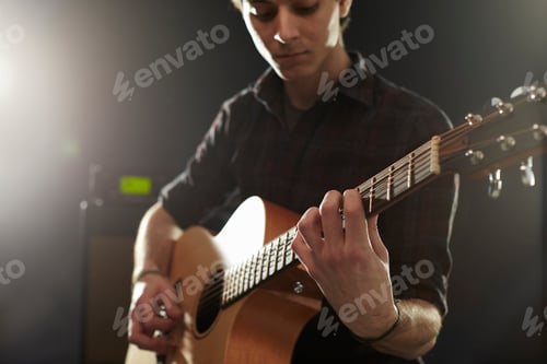 Preview: Man Playing Acoustic Guitar In Studio