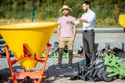 Preview: Agronomist with salesman at the agricultural shop